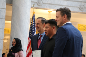 Rep. Thurston with Chris Mann welcoming new citizen