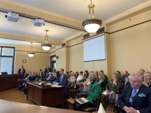 Norm presenting in Senate committee