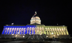 State Capitol light in blue and yellow