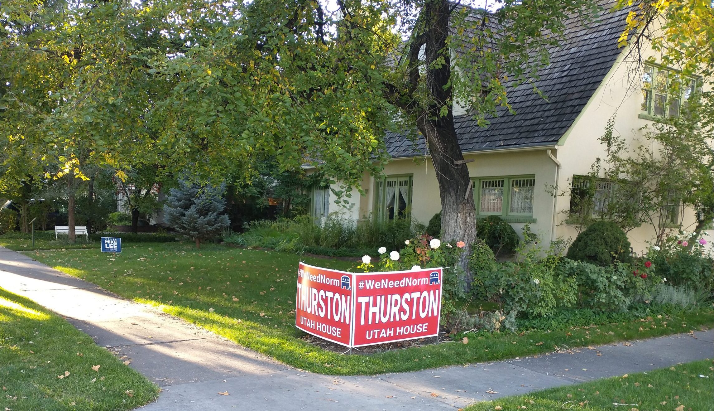 Campaign signs in front of a house